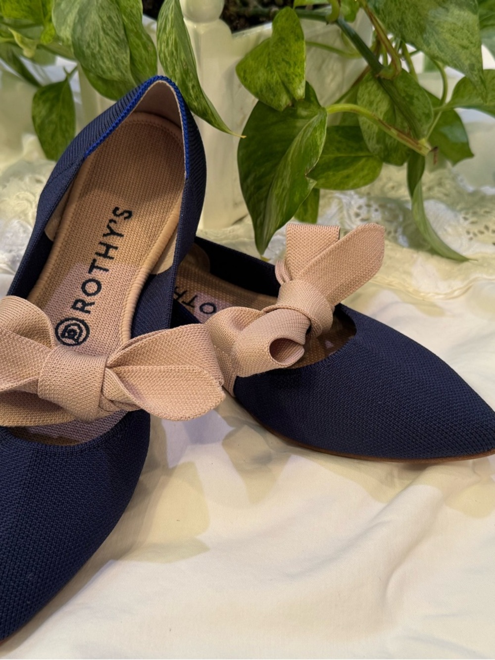 Rothy's Navy Pointed Flats with Blush Bow Accent